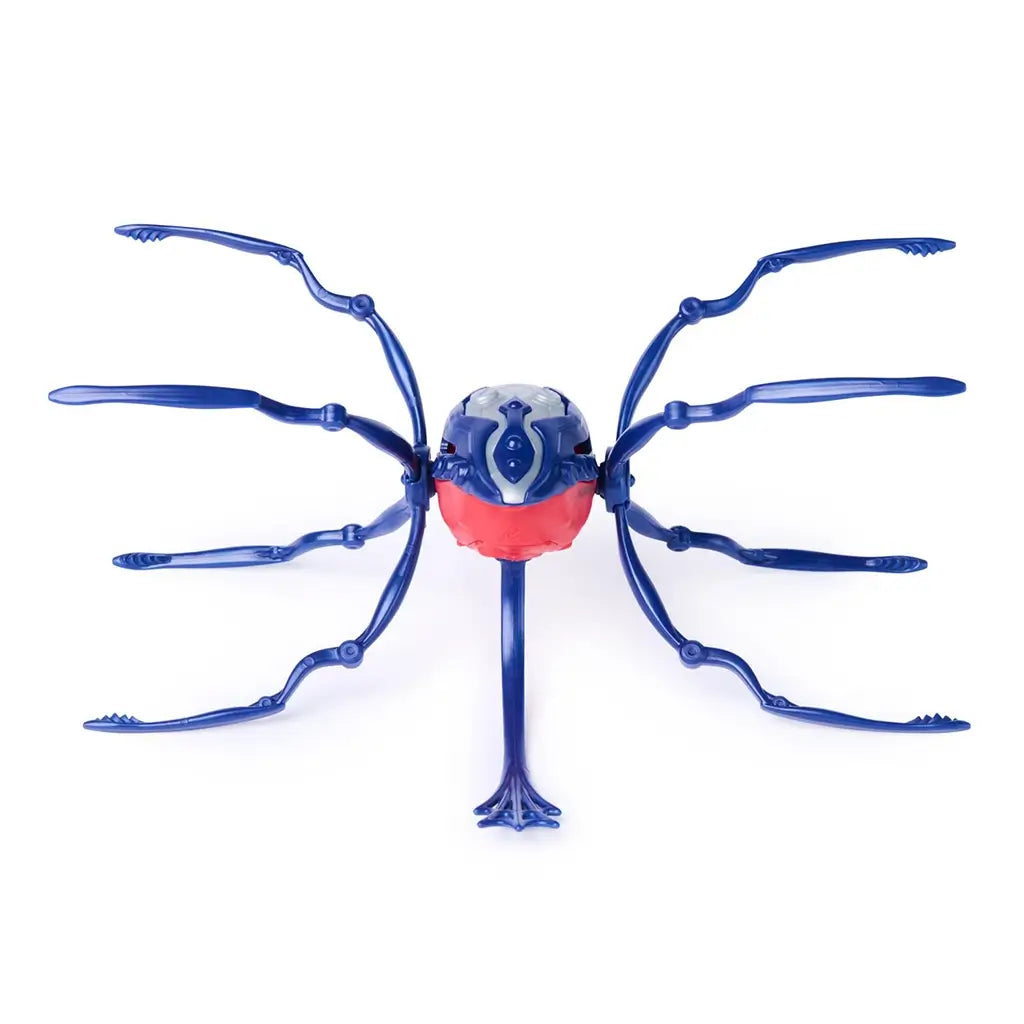 HEX BOTS Skitter Bot spider in navy blue and red molded plastic with segmented body shell and eight extended jointed legs, shown from a top view on a white studio surface.
