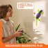 HEX BOTS Wall Crawler glow gecko in purple and neon green molded plastic with spread feet and curved tail, climbing an indoor wall beside a smiling child holding the remote control.