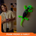 HEX BOTS Wall Crawler gecko in purple and neon green plastic with articulated legs and textured tail, climbing a wall while a child holds the remote in a softly lit bedroom setting. 