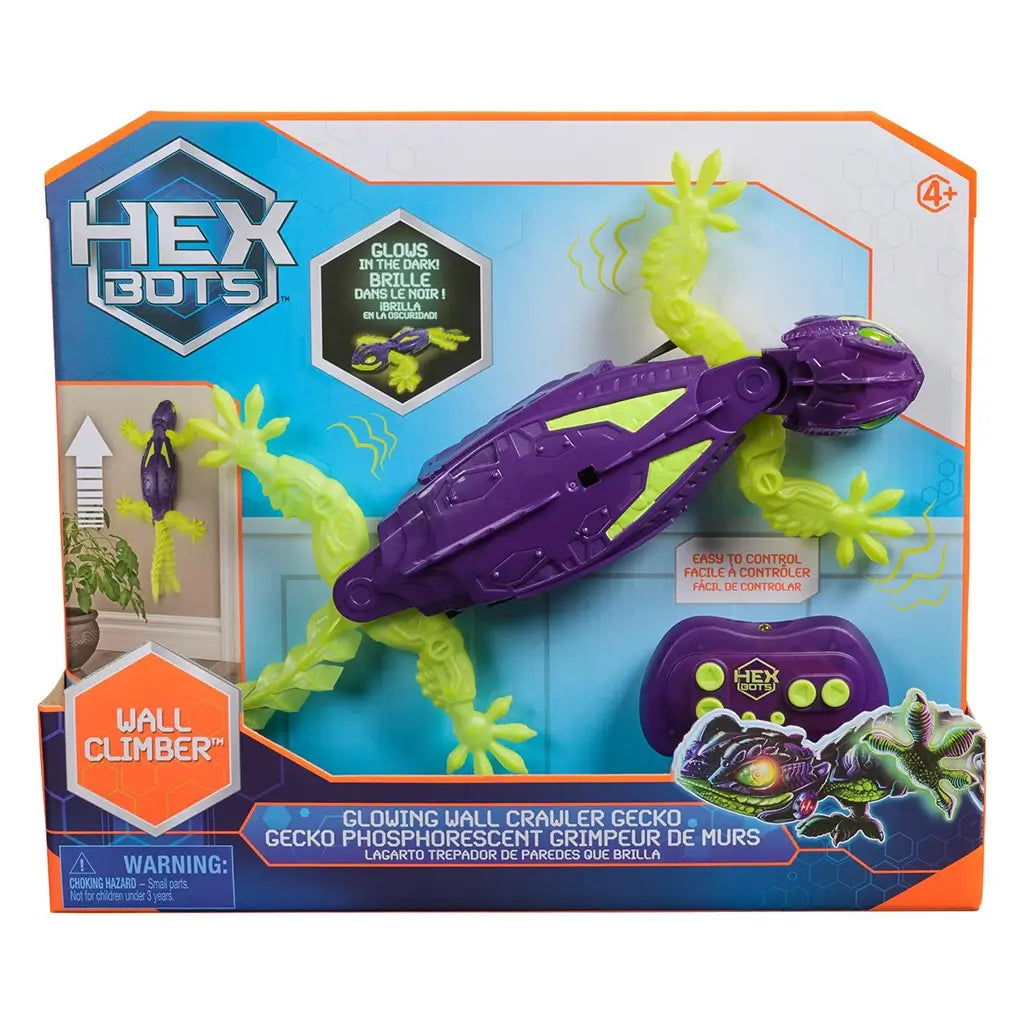 HEX BOTS Wall Crawler glow in the dark gecko in purple and neon green molded plastic, secured in branded retail packaging with remote included and wall climbing feature graphics.