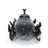 Hex Bots black rhino beetle robot toy with smooth glossy shell, rear view showing rounded body and multiple rotating legs, compact motorized design built for scurrying and bouncing play on white background