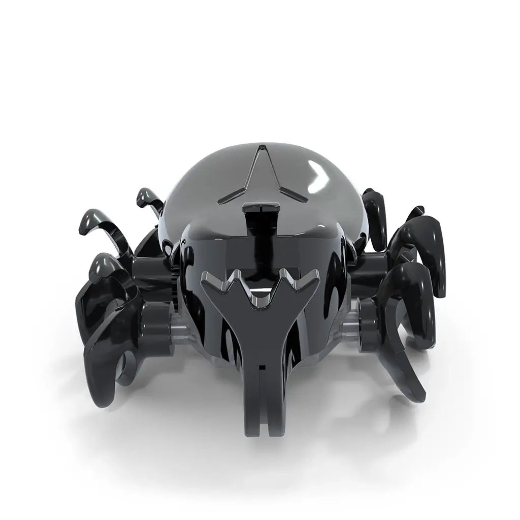 Hex Bots rhino beetle robot in black glossy plastic with smooth oval shell, curved front horn and multiple wheel-like legs, compact motorized toy designed for fast scurrying action on white background