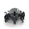 Hex Bots rhino beetle robot in black glossy plastic with smooth oval shell, curved front horn and multiple wheel-like legs, compact motorized toy designed for fast scurrying action on white background