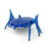 Hex Bots robotic scarab toy in bright blue translucent plastic featuring faceted shell and six jointed legs, compact crawling design for fast flipping play, angled view on white background