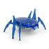 Hex Bots blue scarab robot toy made of translucent plastic with angular shell and six segmented legs, compact motorized design built for quick flipping motion, isolated on clean white background