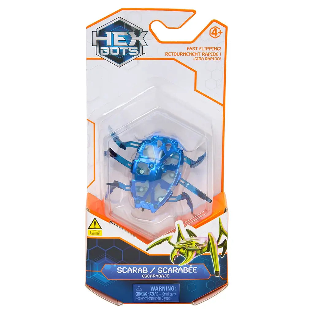 Hex Bots robotic scarab toy in vivid blue translucent plastic with faceted shell and articulated legs, compact hex-shaped body for flipping movement, shown in front retail packaging on white background