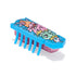 HEXBUG Nano robot bug in blue plastic with pink and green ice cream character graphic, low rectangular body and multiple rubber legs, designed for fast vibrating crawling motion on a neutral white surface.