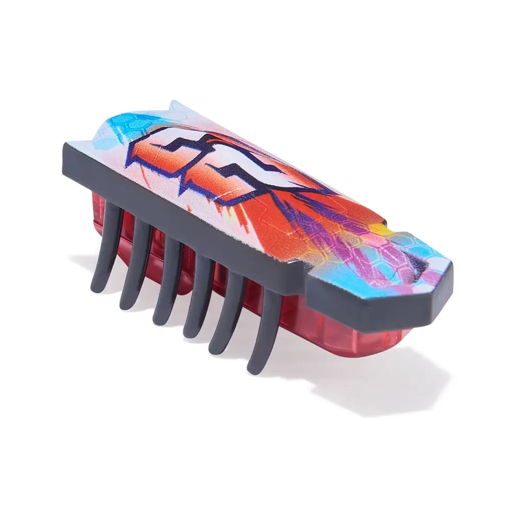 HEXBUG Nano toy robot bright multicolor plastic body with red translucent base and flexible black legs in an angled view, highlighting compact insect-like form for fast crawling play on a plain white background