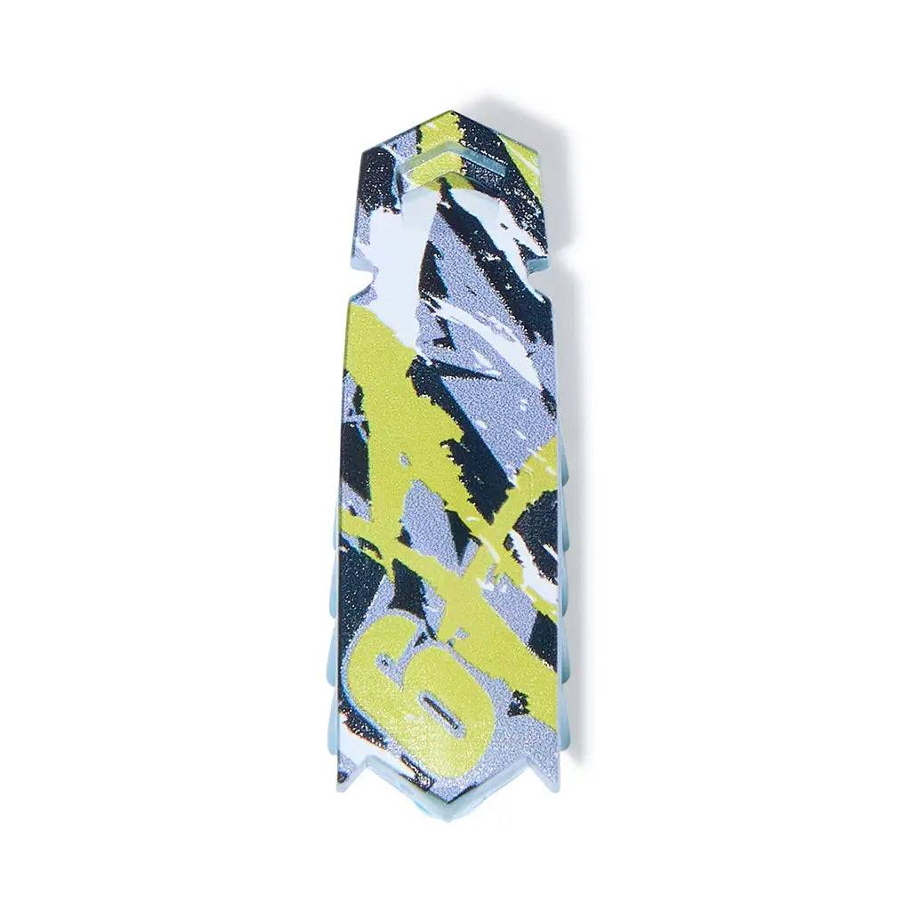 HEXBUG Nano camo robot bug in green, gray, and black glossy plastic, slim rectangular body with angled tip and bold graphic pattern, designed as a vibrating micro robot toy on a plain white background.
