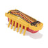 HEXBUG Nano robot bug in yellow plastic with hotdog graphic, red and brown details, low rectangular body and multiple rubber legs, designed for fast vibrating crawling motion on a neutral white surface.
