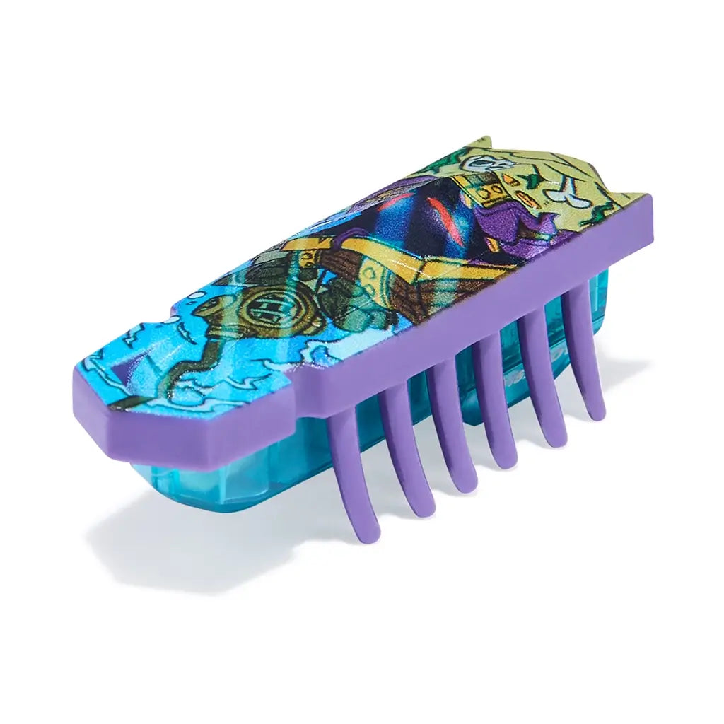 HEXBUG Nano toy robot bright blue and purple plastic shell with scuba diver illustration and teal translucent base with flexible legs, designed for fast crawling movement across flat surfaces on white background