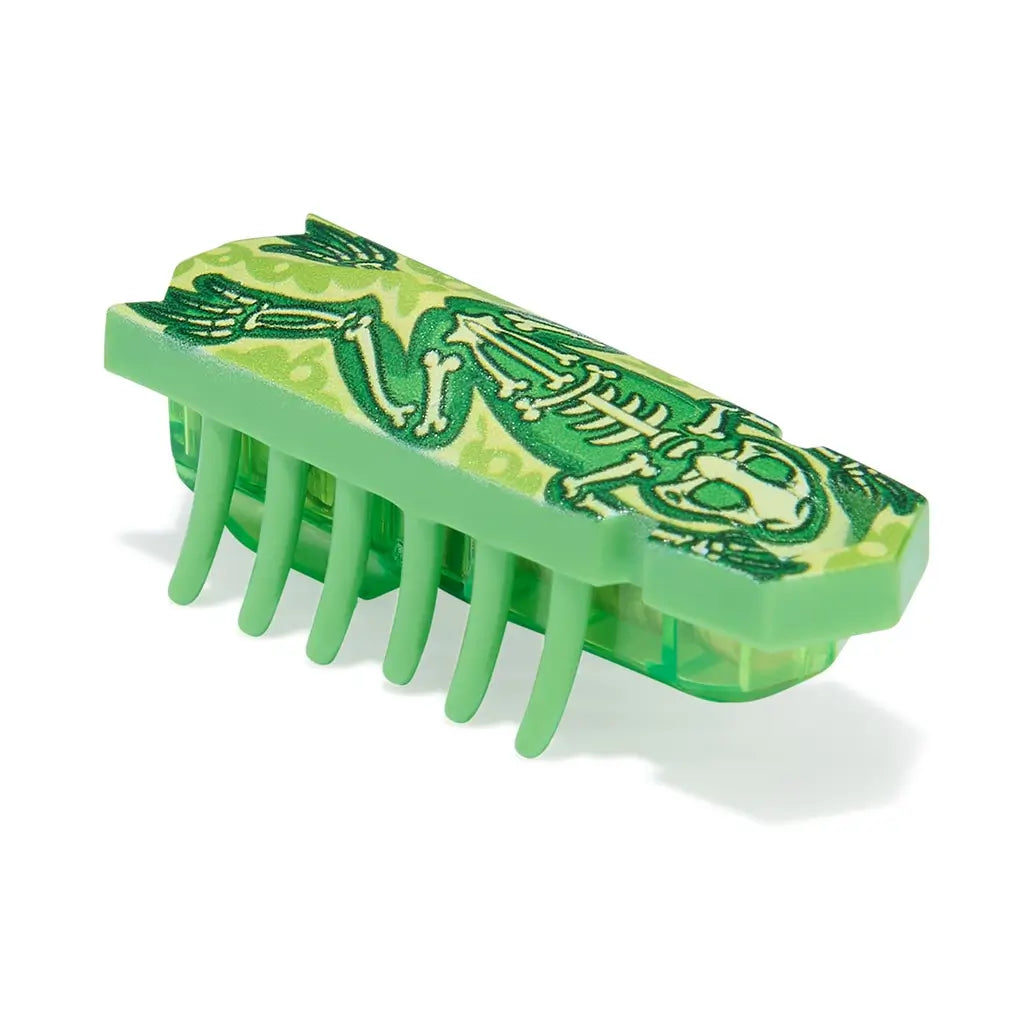 HEXBUG Nano toy robot bright green plastic shell with skeleton frog graphic and translucent green base, featuring multiple flexible legs in a low insect-like form designed for fast crawling play on a white background