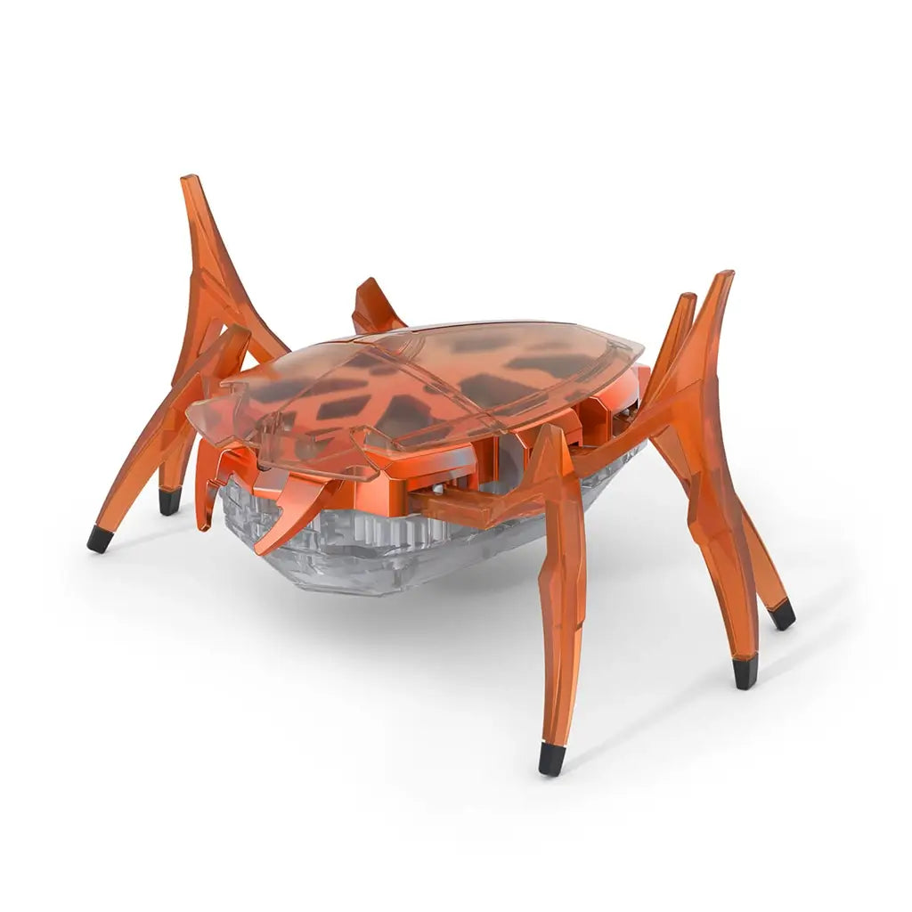 Hex Bots orange scarab robot toy made of translucent plastic with faceted shell and six articulated legs, compact hex-shaped body built for quick flipping movement, angled view on white background