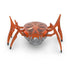 Hex Bots scarab robot in bright orange translucent plastic with low-profile oval shell and six jointed legs, compact motorized toy designed for rapid flipping movement, centered on white background
