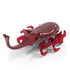 Red robotic beetle toy HEX BOTS with glossy plastic finish, smooth domed body, curved horn and multiple jointed legs, battery powered crawling action, angled view on white background.
