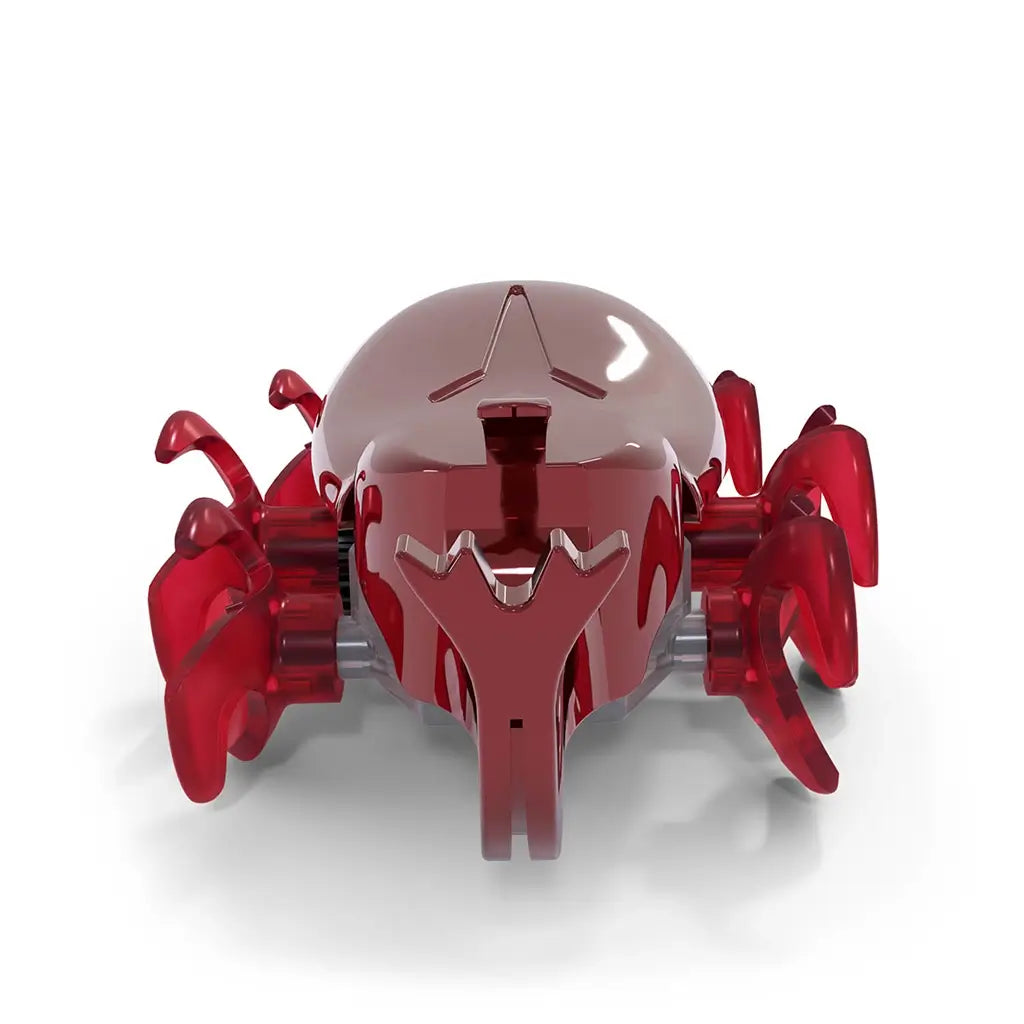Red robotic beetle toy HEX BOTS with shiny plastic surface, curved oval body, extended horn and rotating leg mechanisms, motorized crawling function, isolated on white studio background.