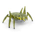 Hex Bots yellow scarab robot toy made of translucent plastic with angular shell and six segmented legs, compact motorized design built for quick flipping motion, isolated on clean white background