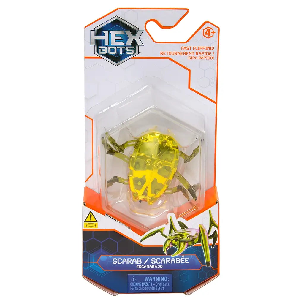 Hex Bots robotic scarab toy in vivid yellow translucent plastic with faceted shell and articulated legs, compact hex-shaped body designed for flipping movement, shown in front retail packaging on white background