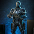 Hot Toys Agent Venom figure in black textured armor with white spider emblem and spiked shoulders, holding a scoped rifle against a dark blue studio backdrop.