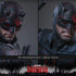Hot Toys Marvel sixth-scale figure face options show two black textured horned mask portraits with red lenses and alternate lower-face expressions on a gray background.