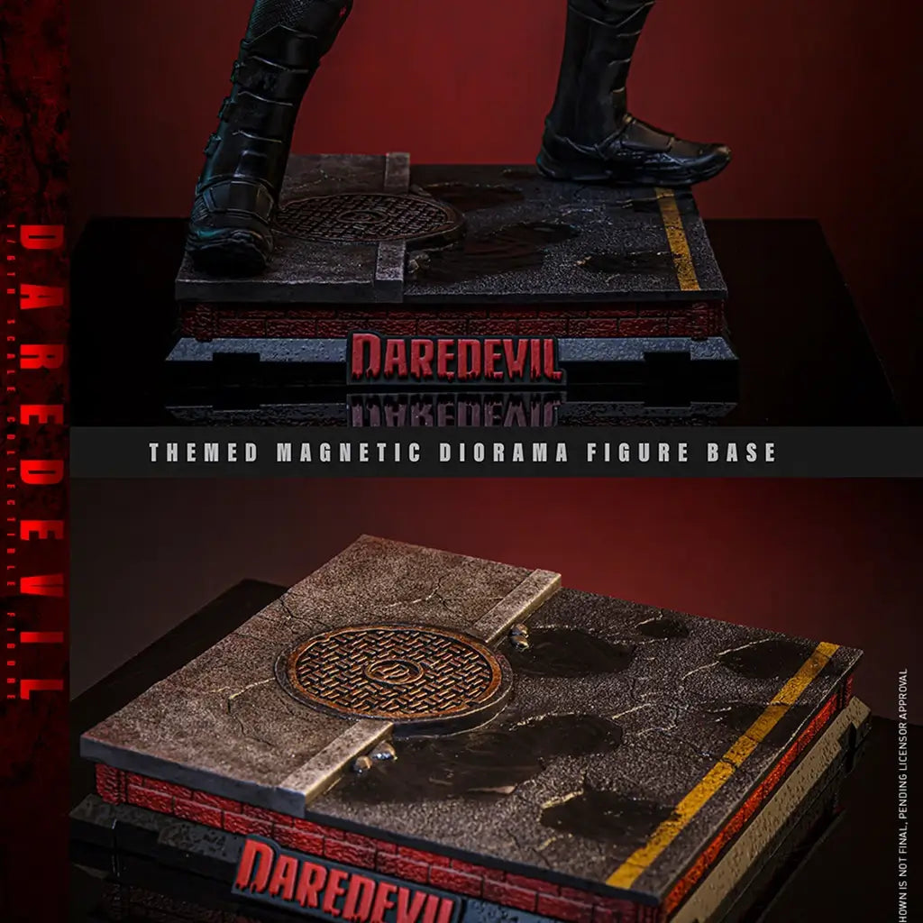 Hot Toys Marvel sixth-scale figure magnetic display base has a weathered street surface, round manhole cover, yellow road stripe and raised red logo on a layered platform.