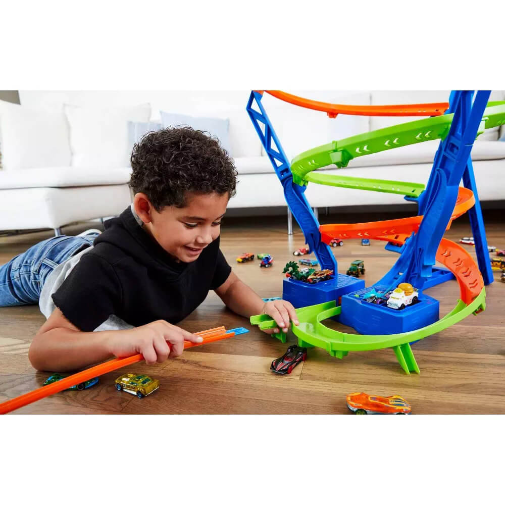 Child playing with hot-wheels-action-spiral-speed-crash-set