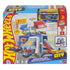 Hot Wheels City Downtown Police Tower retail box front featuring illustrated blue tower playset, police car, action ramps, Speed Snap track icons, age guidance, and bright branded packaging graphics.