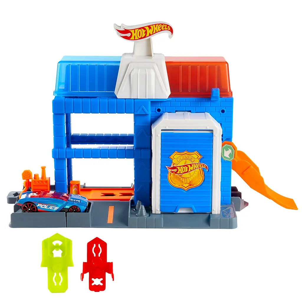 Hot Wheels City Downtown Police Tower playset in blue and gray plastic with orange ramp, rotating rooftop arms, police badge door, and included police car, designed for vehicle launch and capture play.