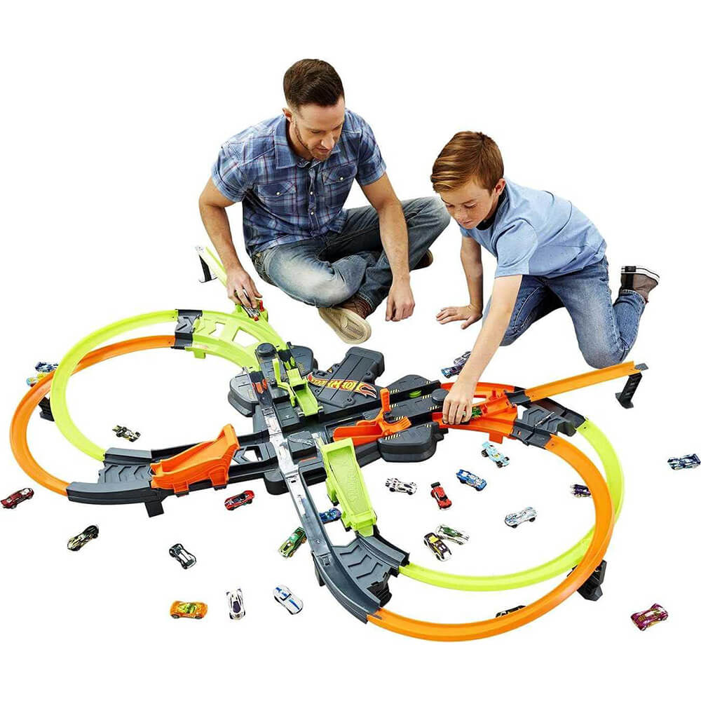 Adult and child playing with the Hot Wheels Colossal Crash Track Set
