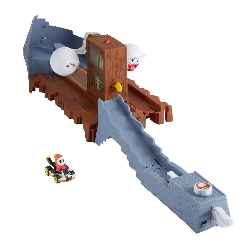 Assembled Hot Wheels Mario Kart Boo’s Spooky Sprint track set features a brown haunted library obstacle with turning bookshelf and two Boo ghosts blocking the racing path.
