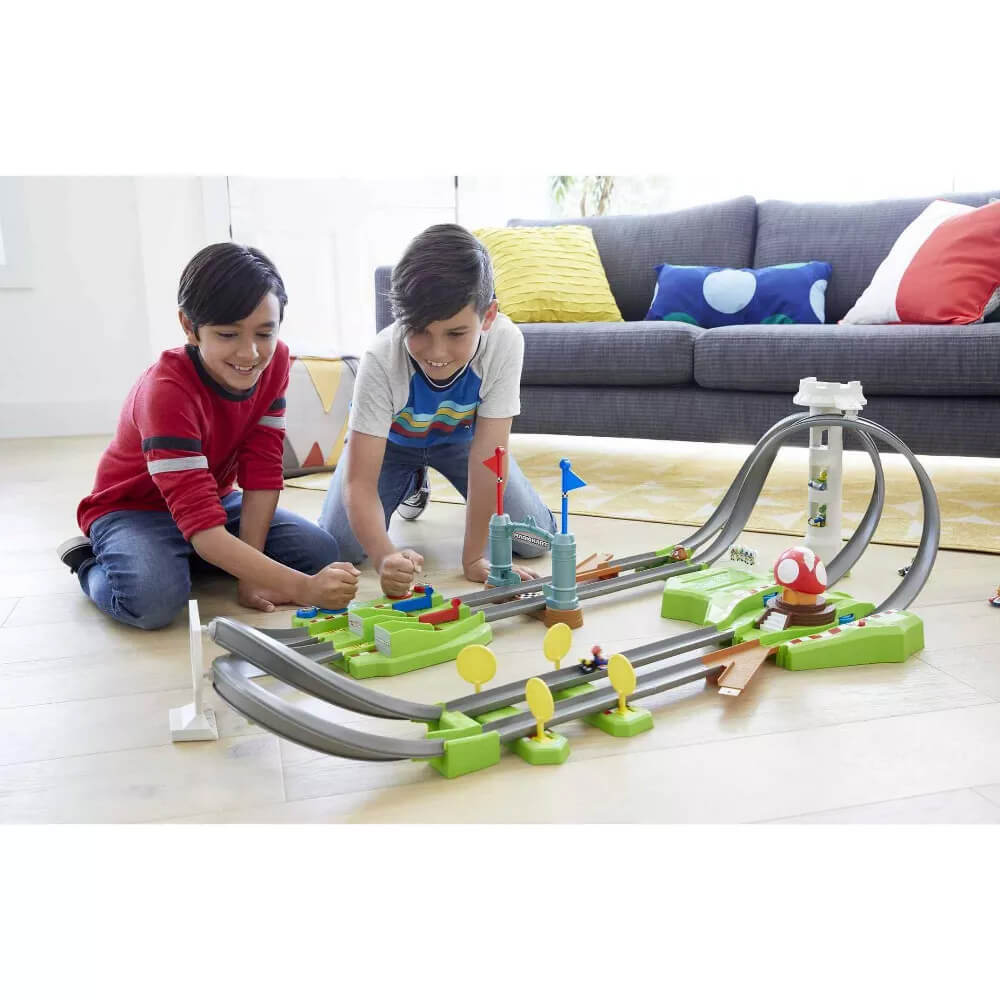 Kids playing with the Hot Wheels Mario Kart Circuit Slam Track Set