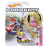 Hot Wheels Mario Kart Princess Peach Standard Kart retail package with clear blister, showing the pink and yellow kart toy inside, Mario Kart artwork, Princess Peach portrait, and Hot Wheels branding on a carded front.