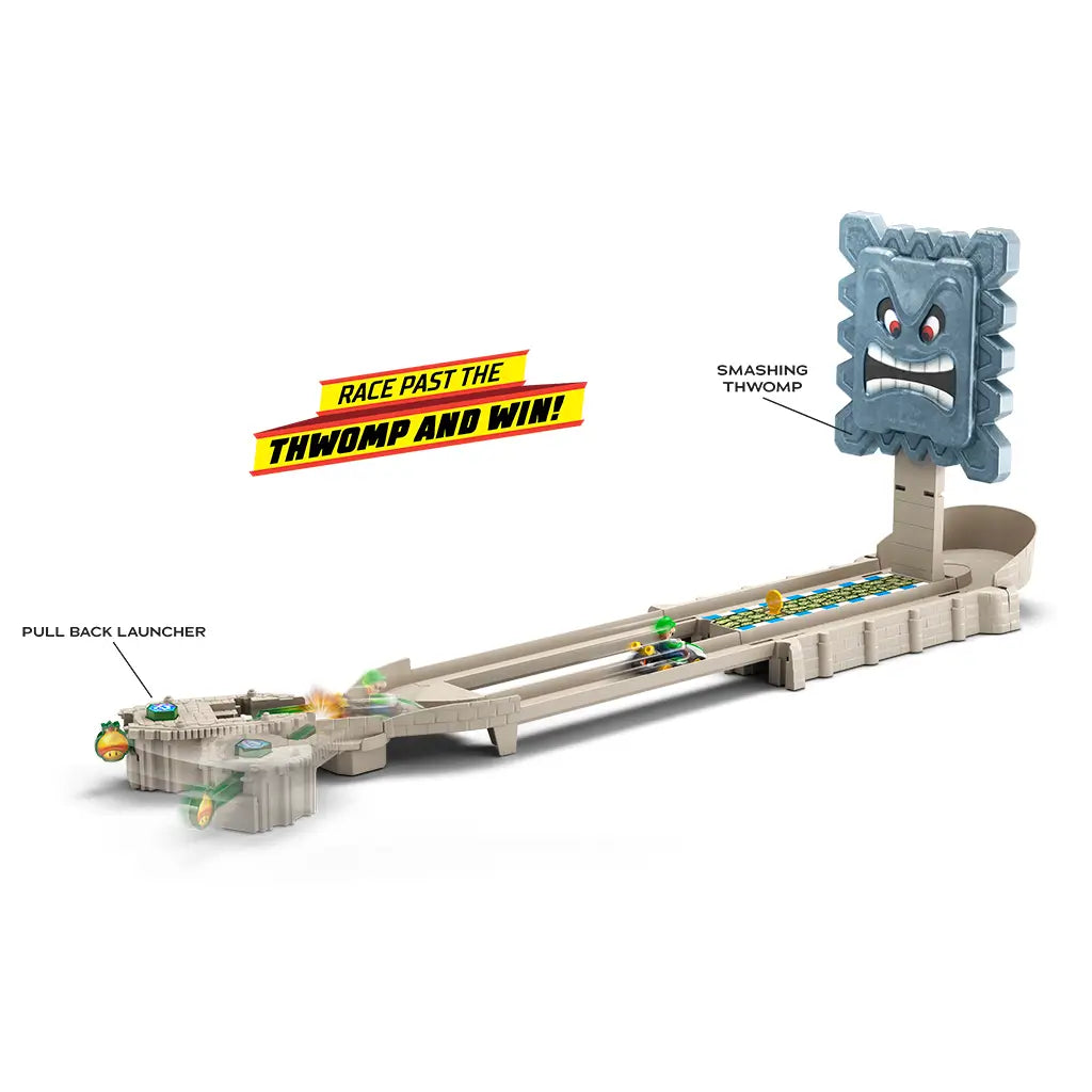 Hot Wheels Mario Kart Thwomp Ruins track set with beige plastic track, pull-back launcher, and large gray stone Thwomp obstacle featuring a fierce face, creating an interactive racing challenge.