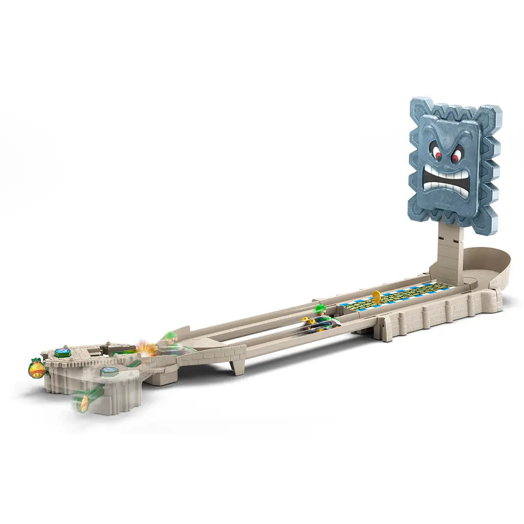 Hot Wheels Mario Kart Thwomp Ruins playset featuring a beige dual-lane track, pull-back launcher, and towering gray Thwomp obstacle with a fierce face, designed for interactive racing excitement.