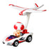 Hot Wheels Mario Kart Toad diecast car angled view highlights white kart body, red accents, black wheels, purple windshield, and large rear-mounted white and red plane glider.