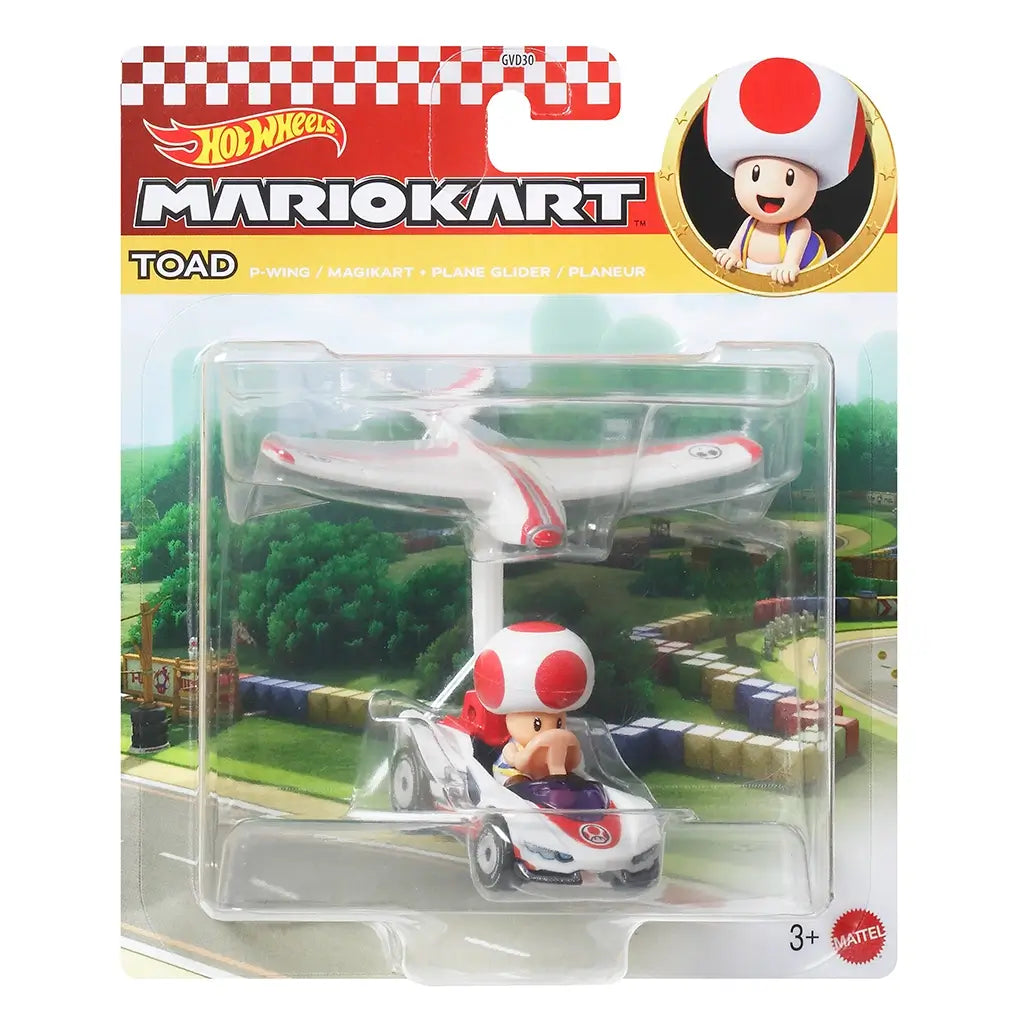 Hot Wheels Mario Kart Toad toy in retail packaging shows Toad in his P-Wing kart with white and red plane glider, set against a colorful racetrack background on card art.