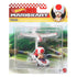 Hot Wheels Mario Kart Toad toy in retail packaging shows Toad in his P-Wing kart with white and red plane glider, set against a colorful racetrack background on card art.