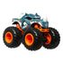 Hot Wheels Rhinomite monster truck toy featuring textured blue rhino design, white horns, orange chassis, and oversized black wheels with bold orange rims for off-road action.