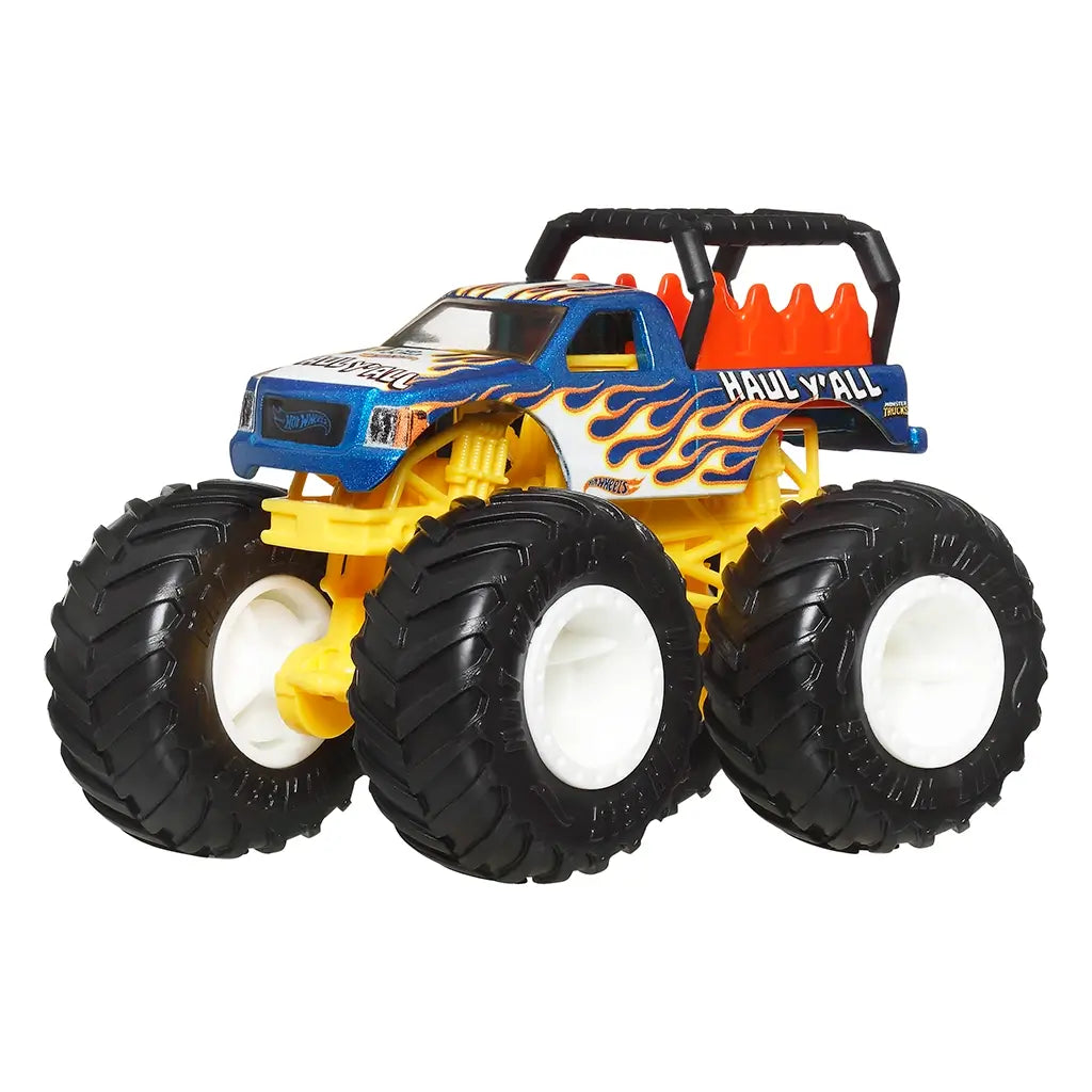 Hot Wheels Haul Y’All monster truck with blue cab, flame graphics, yellow chassis, oversized black tires with white rims, and rugged pickup design built for racing excitement.