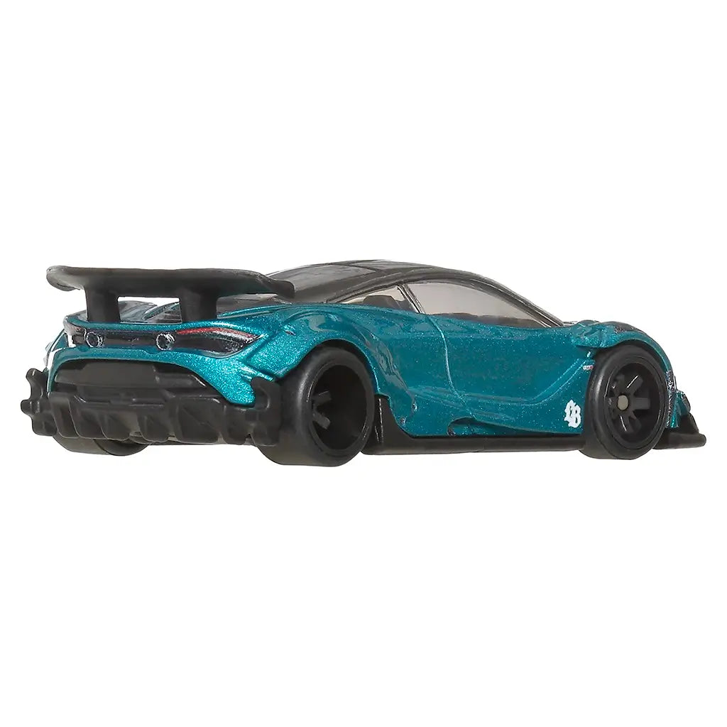 Rear angle view of a Hot Wheels teal toy car with black accents on a white background