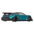 Rear angle view of a Hot Wheels teal toy car with black accents on a white background