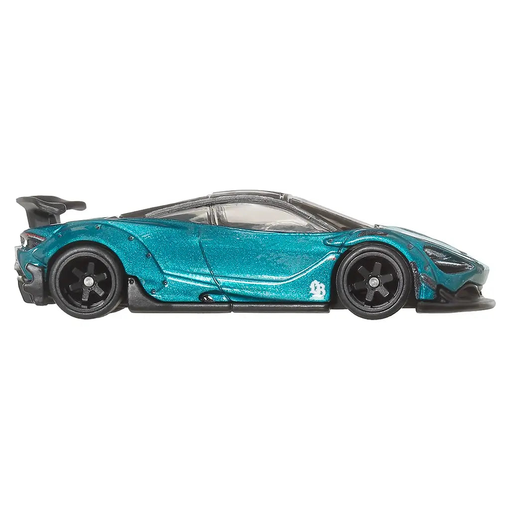 Side view of a Hot Wheels eal toy car with black wheels on a white background
