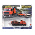 Hot Wheels Toyota AE86 packaging displays the red metal flatbed truck and AE86 coupe in a molded plastic blister, with bold car-culture artwork and a scenic road backdrop highlighting the transport theme.