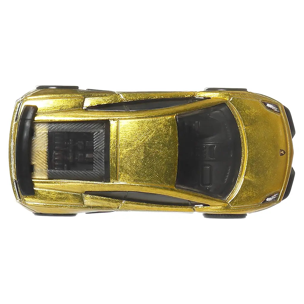 Top view of Hot Wheels Premium Lamborghini Gallardo LP 570-4 Superleggera, showing metallic gold roof and hood, black window detailing, engine cover texture, and compact supercar proportions on a white background.