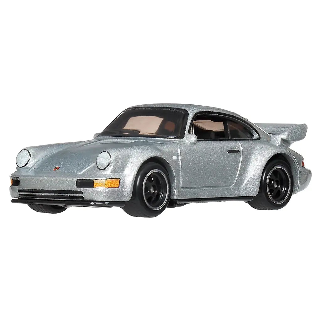Hot Wheels Porsche 911 Carrera RS 3.8 diecast car in metallic silver metal with rounded fenders, low coupe stance, black alloy-style wheels, front bumper details, and rear spoiler, shown at an angled view on white.