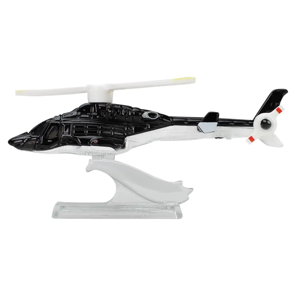 Hot Wheels Premium Airwolf helicopter side view showing a black die-cast metal fuselage, white tail boom, detailed cockpit windows, mounted rotor assembly, and clear display stand, photographed cleanly against a white background.