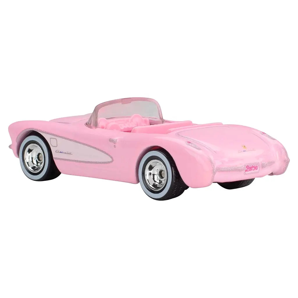 Angled view of Hot Wheels Barbie 1956 Corvette, featuring pink bodywork, chrome wheels, and Barbie license plate detail.