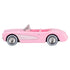 Side profile view of Hot Wheels Barbie 1956 Corvette diecast car in pastel pink with silver glitter side trim and whitewall tires.