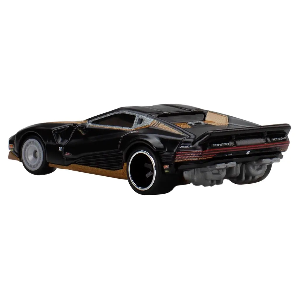 Hot Wheels Premium Quadra Turbo-R V-Tech rear angled view showing black and gold paint finish, wide stance, exposed rear mechanical details, spoiler, and detailed taillight design.