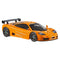 Front angled view of Hot Wheels 1995 McLaren F1 GTR die-cast toy car in bright orange, emphasizing low stance, black spoiler, sculpted vents, racing wheels, and tinted glass on white background.